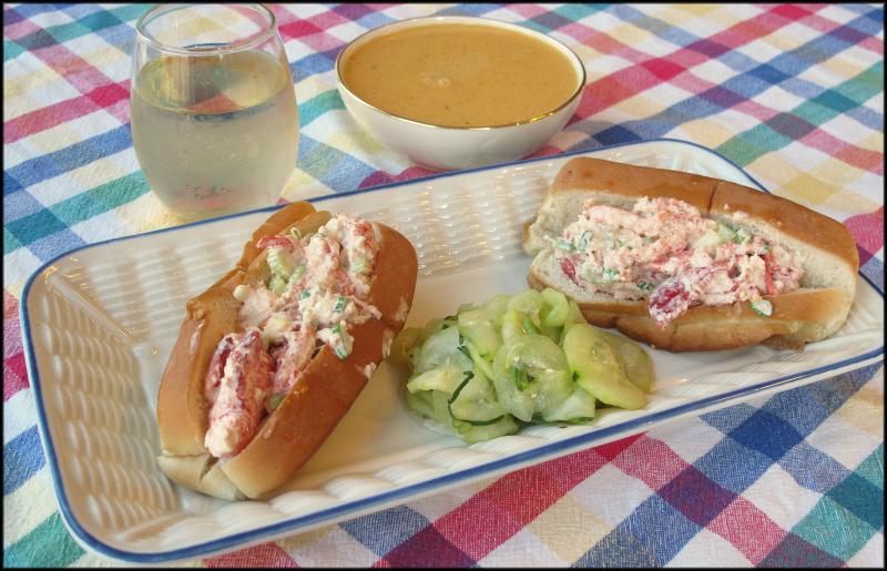 A local takeout meal: lobster rolls with crab bisque, a cucumber salad and wine. JACK CLEMONS PHOTO
